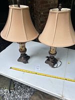 Full view of both lamps on table with measuring tape