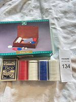 Front view of boxed poker set, Bee deck and three chip racks