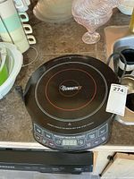 Full view of NuWave Pro induction cooktop showing front control panel and power cord