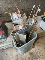 Overall view of tote and box with hardware contents
