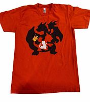 Front view of orange Pokémon evolution T-shirt
