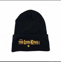 Front view of black knit beanie showing embroidered The Lion King logo