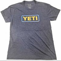 Front view of navy Yeti Coolers T-shirt laid flat