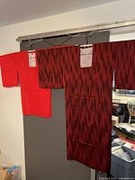 Full view of both kimono robes hung side by side