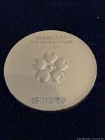 Obverse of copper medal showing Expo '70 logo, inscription and date