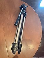 Tripod folded showing leg locks and panhandle