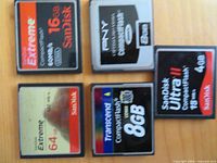 Five CompactFlash cards showing brands and capacities