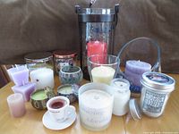 Group shot of all candles and holders on tabletop