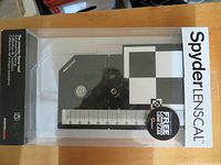 Front view of sealed Datacolor Spyder LENSCAL package