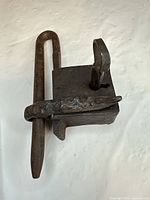 Padlock side view showing body, hasp, and key inserted
