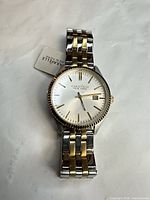 Front view of Caravelle watch showing dial, bezel and bracelet