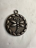 Front view showing dragonfly motif and border detail