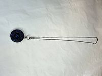 Full view of necklace showing pendant and chain