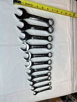 All thirteen Craftsman wrenches laid out with tape measure