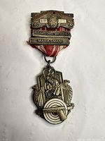 Full view of medal with ribbon and pin bar