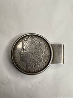 Full view of money clip with coin inset