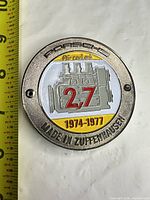 Front view with measuring tape showing full design and diameter