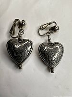 Front view of both heart clip-on earrings