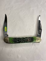 Knife open showing both blades and handle