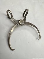 Overall view of trimmer showing scissor loops and curved arms