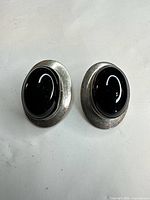Front view showing oval black cabochon set in sterling