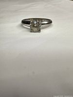 Front view showing clear stone in solitaire setting and band condition
