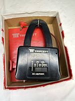 Front view of Triplett Model 10 ammeter inside original box