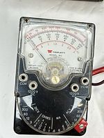 Front view of Triplett Model 310 multimeter showing dial, scale and selector