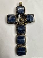 Full view of cross pendant showing overall design and stone layout