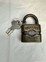 Front view showing Fidelity and Yale stamps, keys attached