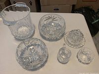 All seven crystal pieces grouped on table