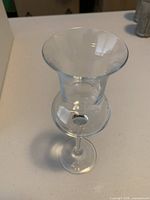 Single glass top view showing flared tulip bowl and ball knop