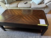 Top view of rectangular dark brown coffee table showing veneer pattern and overall surface