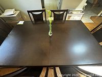 Top view of rectangular dark brown dining table