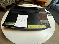 Top view of Oreck air purifier showing control panel and overall condition