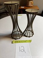 Front view of both candlesticks showing height difference and twisted rope design
