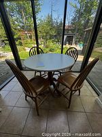 Full view of round table with four chairs