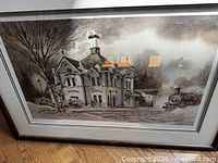 Framed winter Victorian building with train artwork front view