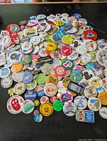 Top view of large spread of assorted buttons