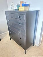 Front view showing five drawers and overall design