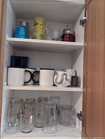 Cupboard view showing entire lot across three shelves