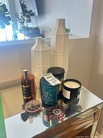 Group shot showing all items: two vases, three candles, room spray, dreamcatcher