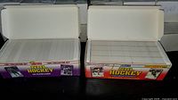 Open boxes showing card stacks inside 1990 and 1991 Score sets