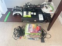 Full bundle overview showing console, Kinect, controllers, game stack, cables