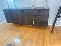 Front view showing full sideboard, door and drawer layout