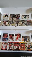 Open two-row box displaying stacks of hockey trading cards
