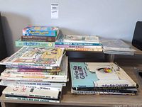 Stacks of Calvin and Hobbes, Far Side and other cartoon paperbacks on shelf surfaces