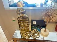 All primary decor pieces grouped on mirrored table
