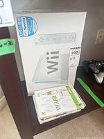 Wii console box with Wii Fit case visible