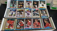 Overview of long box filled with assorted O-Pee-Chee hockey cards, several cards pulled forward for visibility
